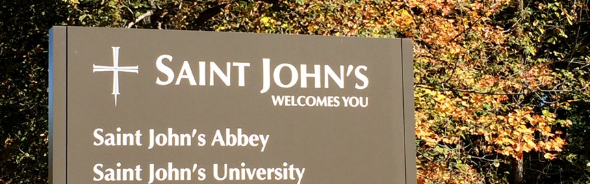 Sign reading "St John's welcomes you"