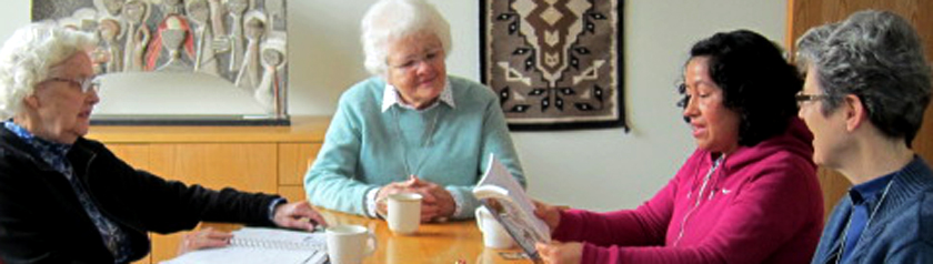 Sisters Joanne and Mary David, Paz and Sister Lynne gathered for conversation around the table.